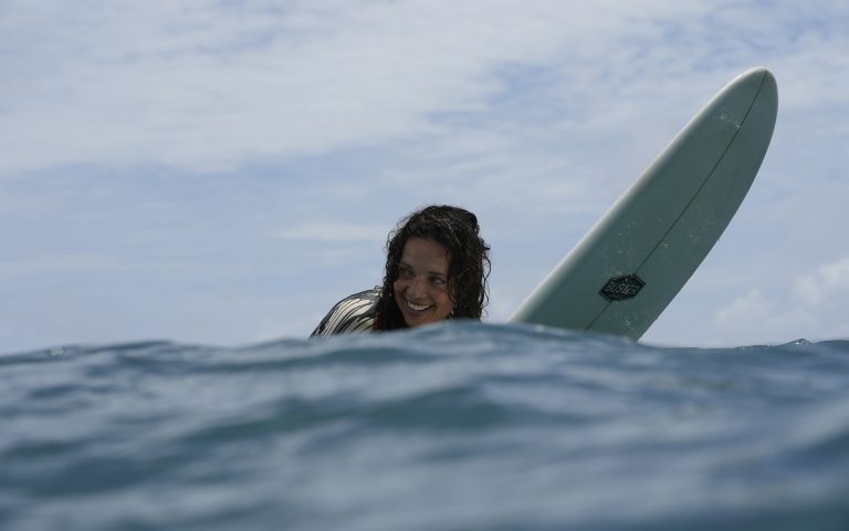 Surfer smiling in the water during Maldives Surf Trip 2026 with Nordes Surfhouse in the Central Atolls.