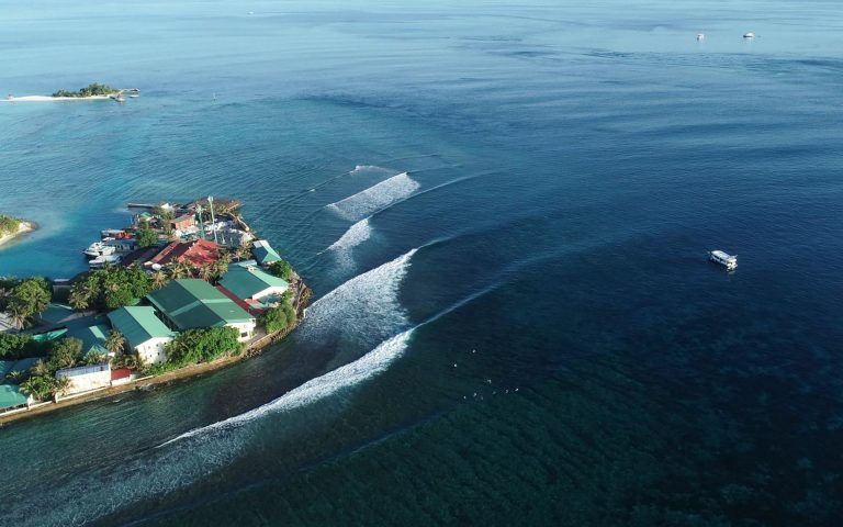 Aerial view of reef breaks and islands in the Maldives Central Atolls during Nordes Surfhouse surf trip.
