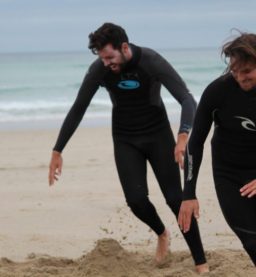 students warming up before surf