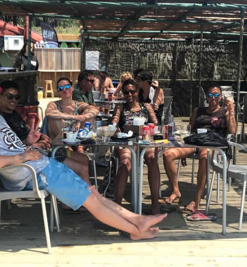 having a drink at a beach bar